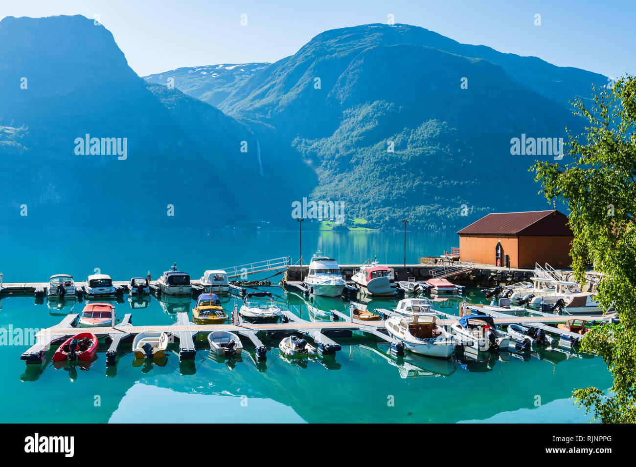 Moored boats by lakeside and mountains, Hoyheimsvik, Lusterfjord, Norway, Europe Stock Photo