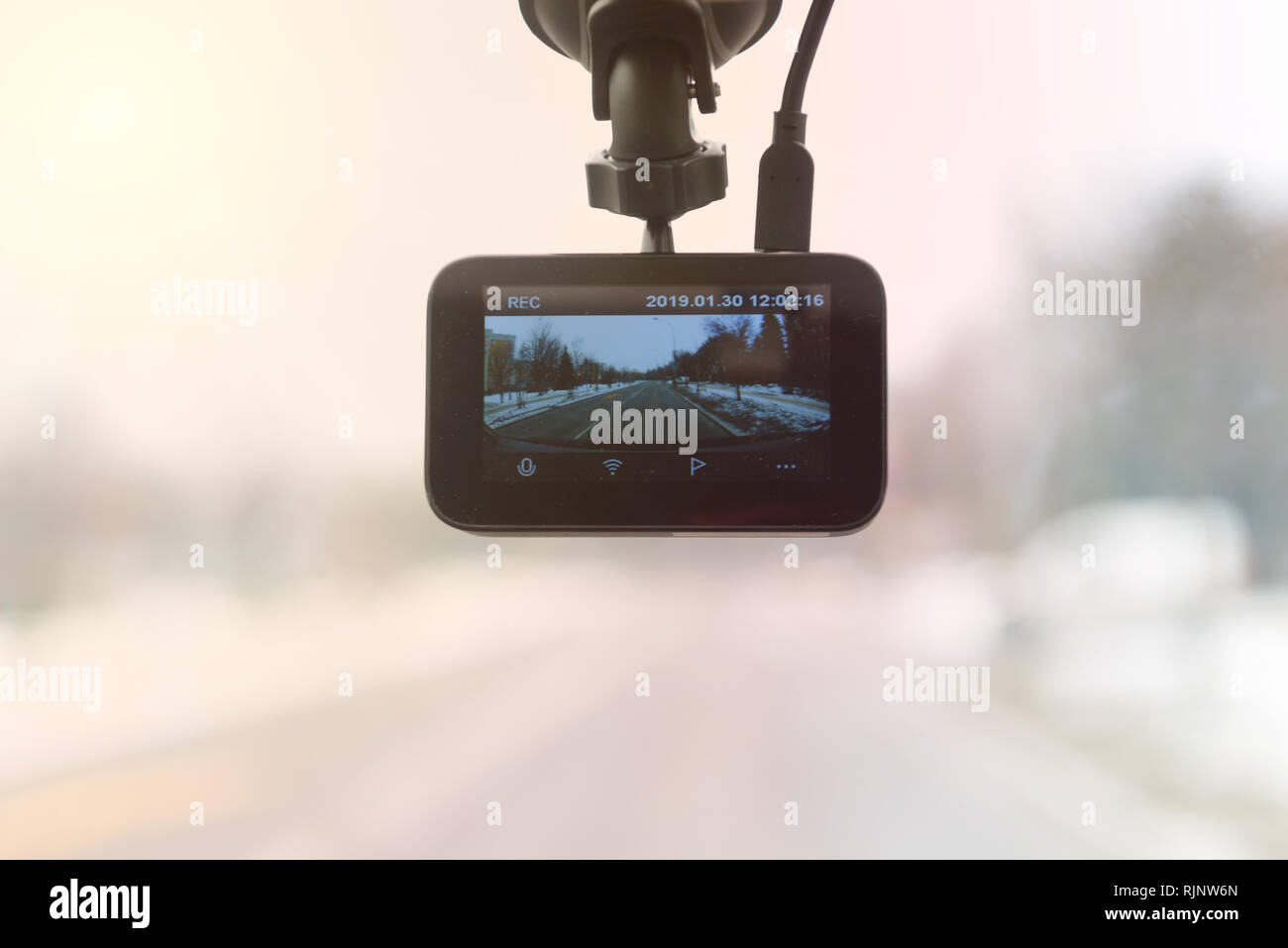 Using dashboard camera to continuously record a view through a vehicle