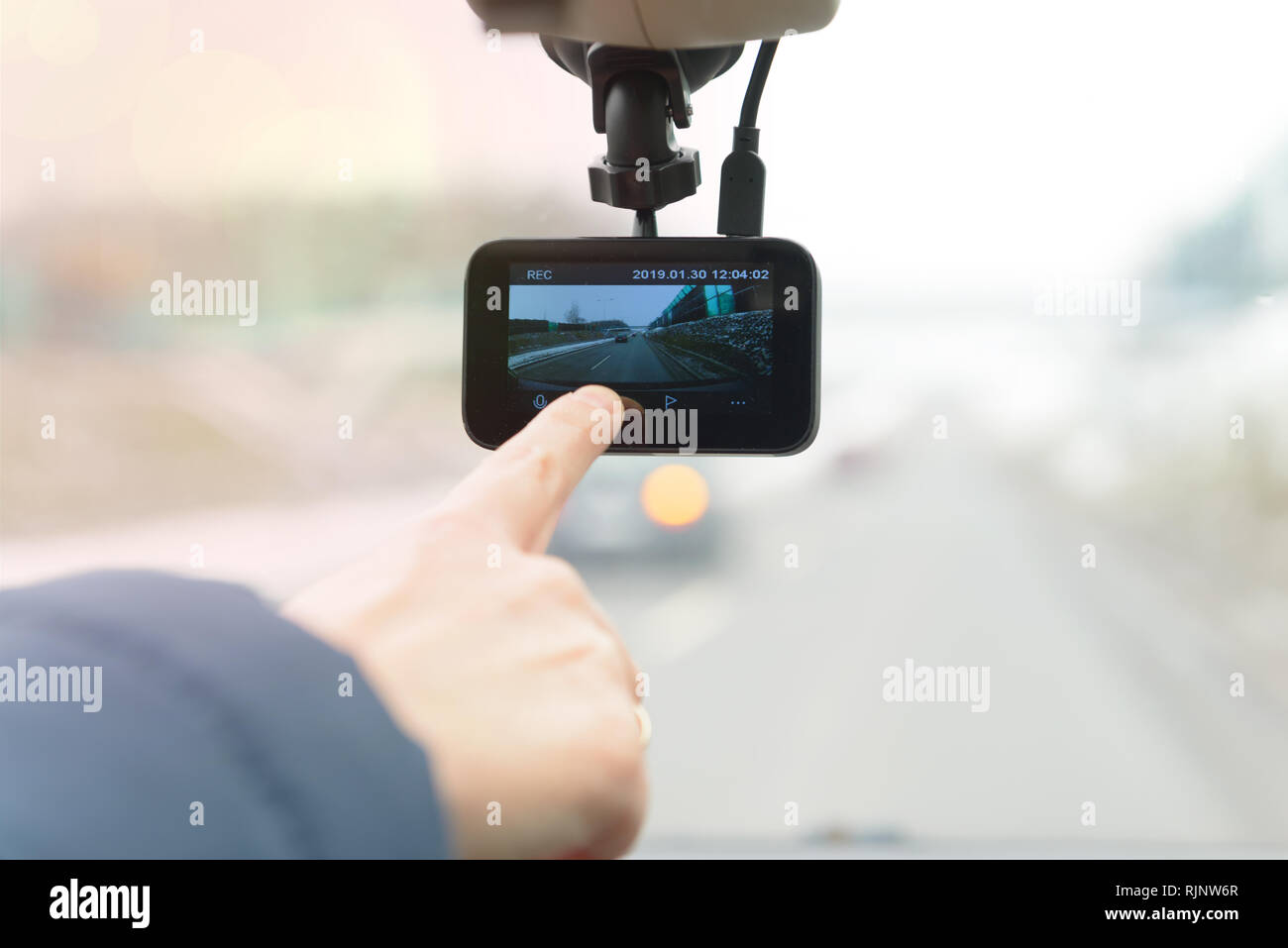 Using dashboard camera to continuously record a view through a vehicle