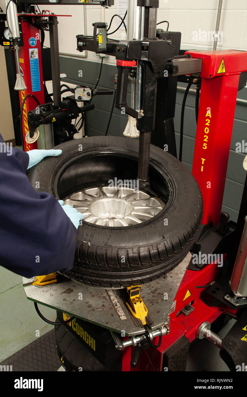 Changing a car tyre Stock Photo Alamy
