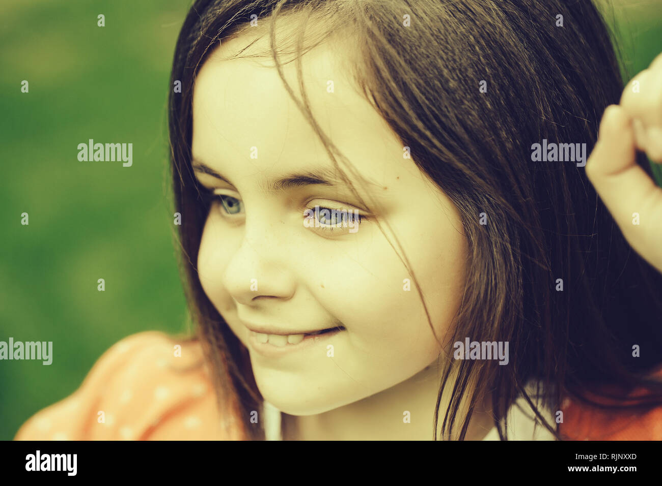 Happy smiling small girl outdoor Stock Photo - Alamy