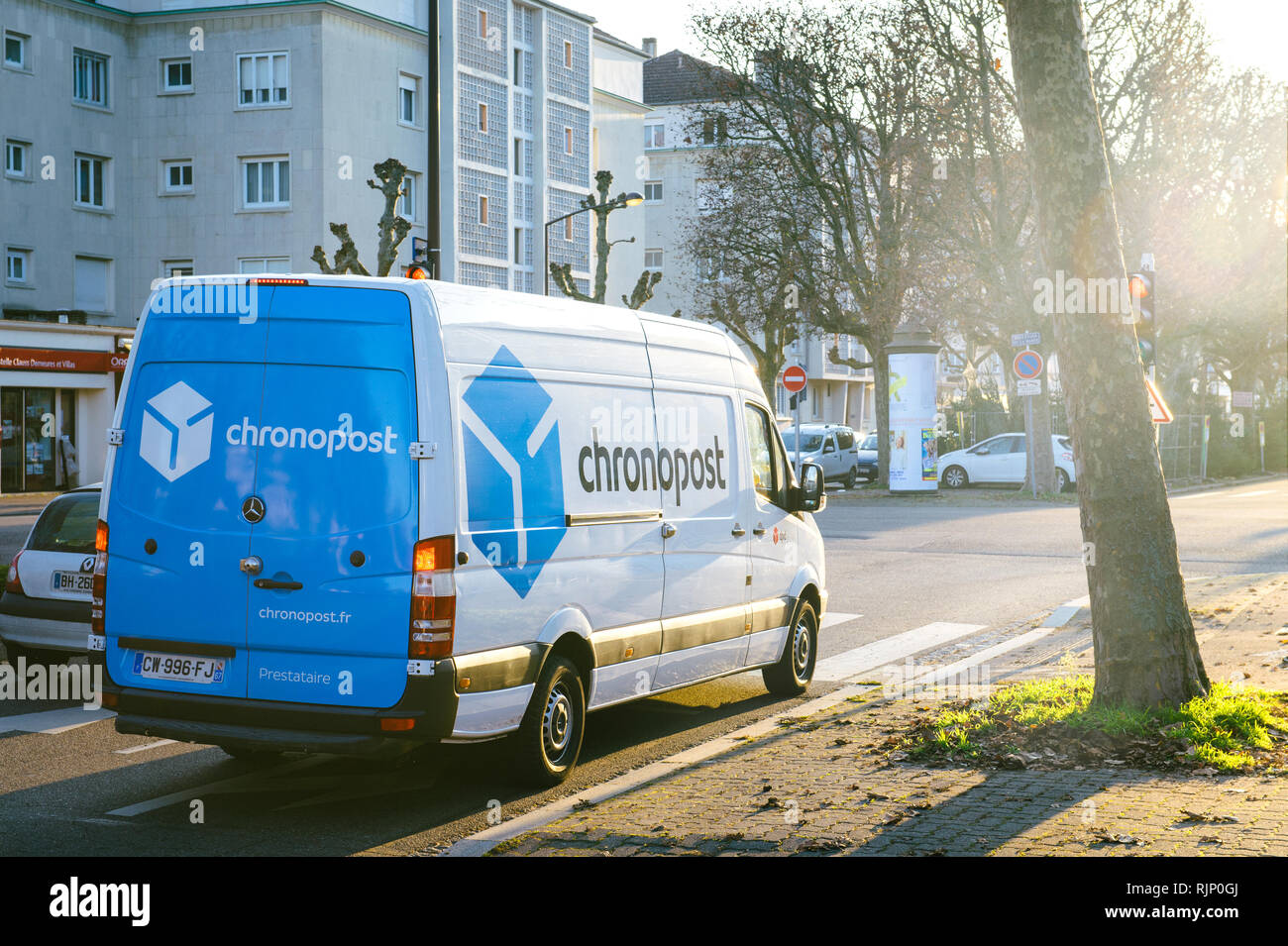 STRASBOURG FRANCE - DEC 19, 2016: DPD from La Poste delivery vans in center of the city on sunny street early in the morning. Chronopost and DPD is part of French group La poste  Stock Photo