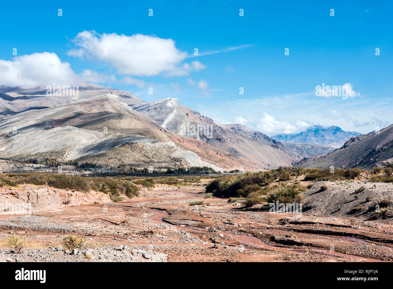 Layered sedimentary rocks in the colorful valley of the Rio Grande (Spanish for 'great river'), south of Mendoza Province, Argentina Stock Photo