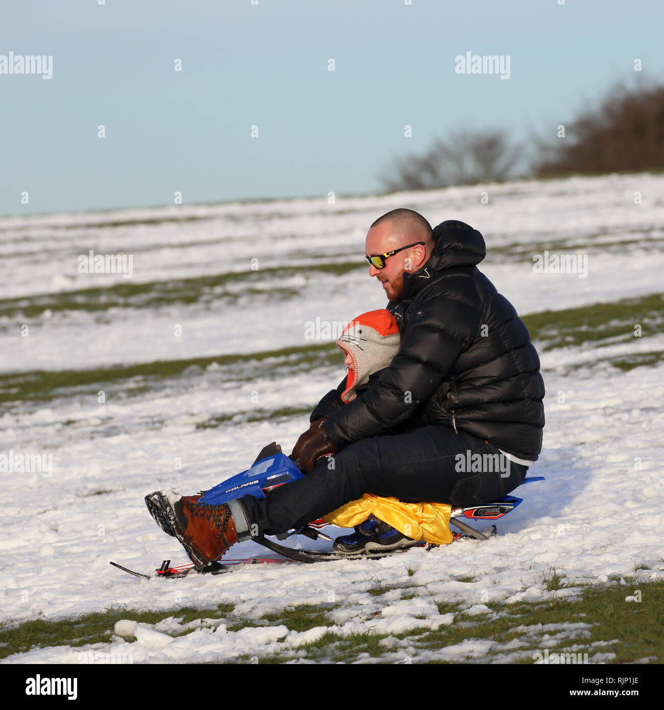 Sledging on the Dunstable Downs, Bedfordshire, England, UK Stock Photo ...