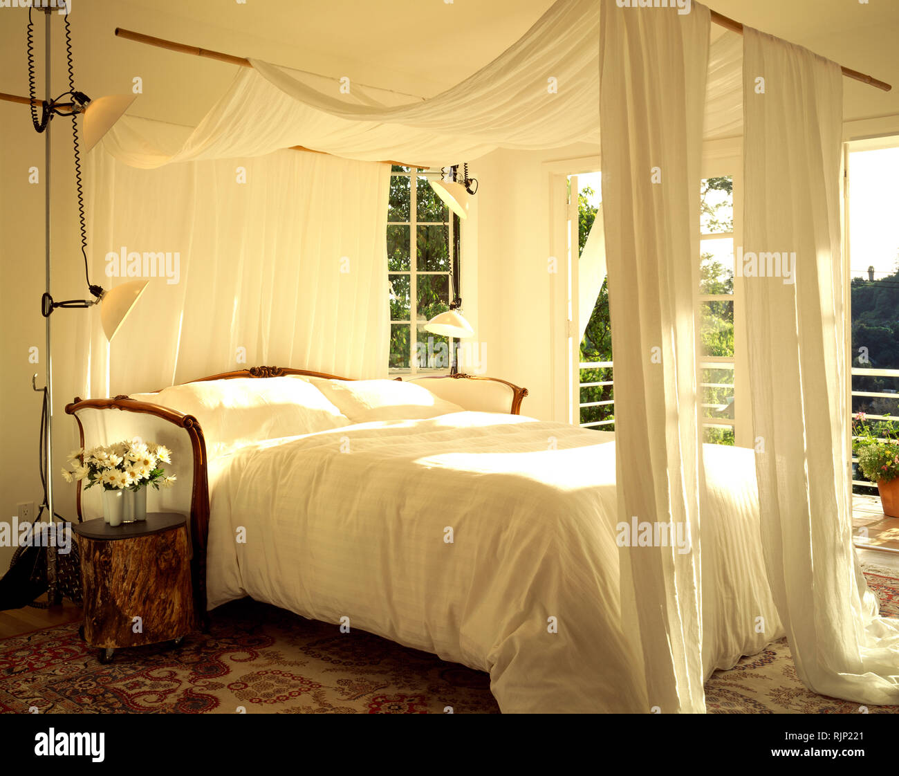 White Voile Drapes And Canopy On Bed Stock Photo 235283161 Alamy
