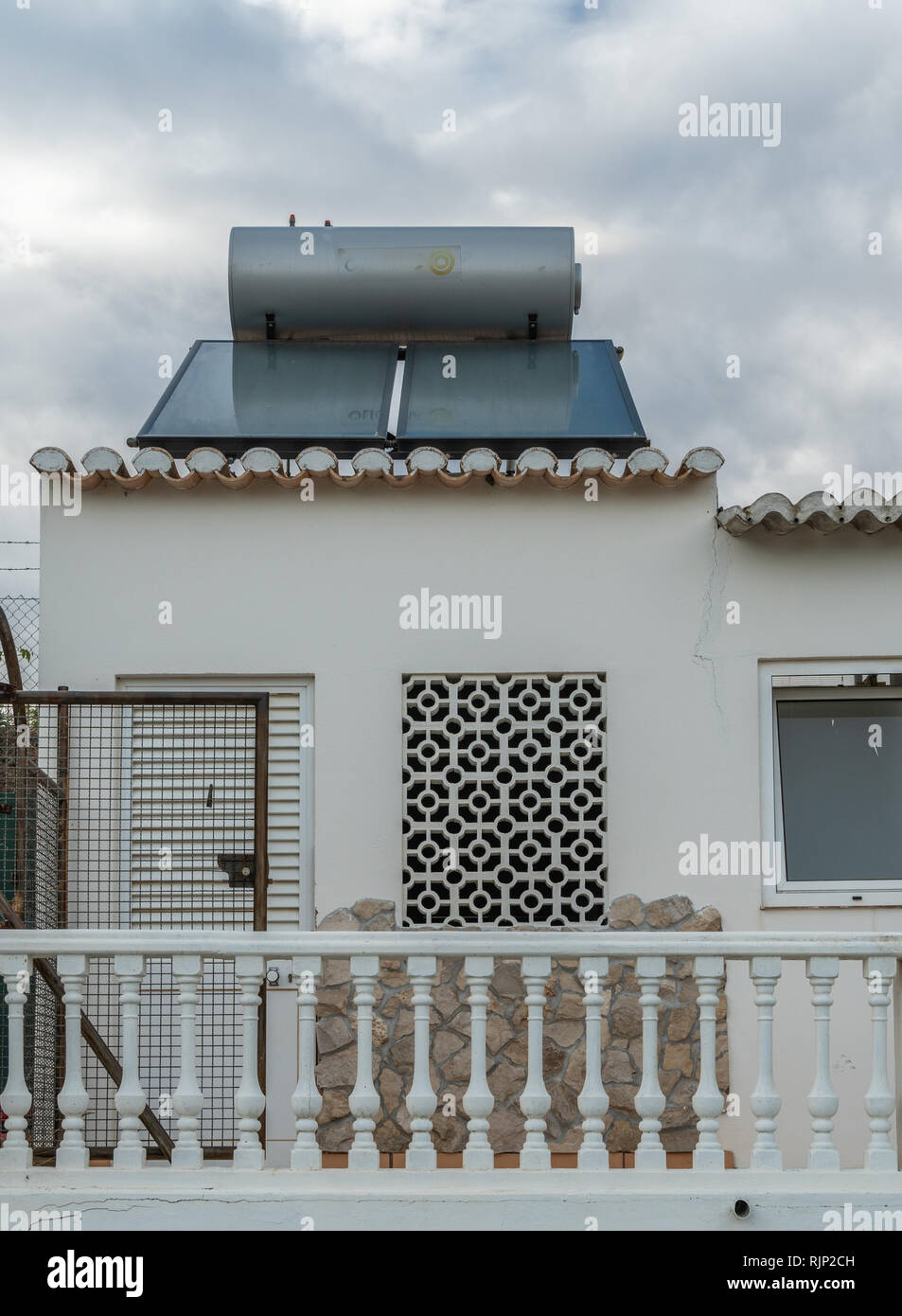 solar panel over a garden during a cloudy sky Stock Photo
