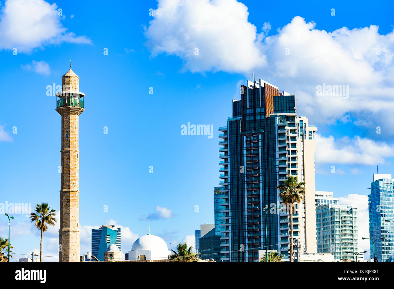 Partial view of Hasan Bey Mosque and some modern skyscrapers in the background. Beautiful sunny day in Tel Aviv, Israel. Stock Photo