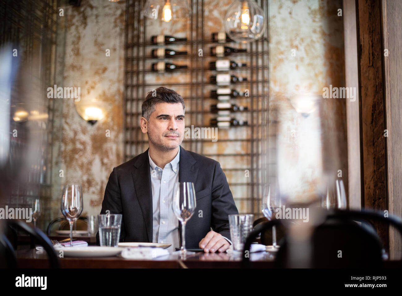 Businessman thinking in a restaurant Stock Photo