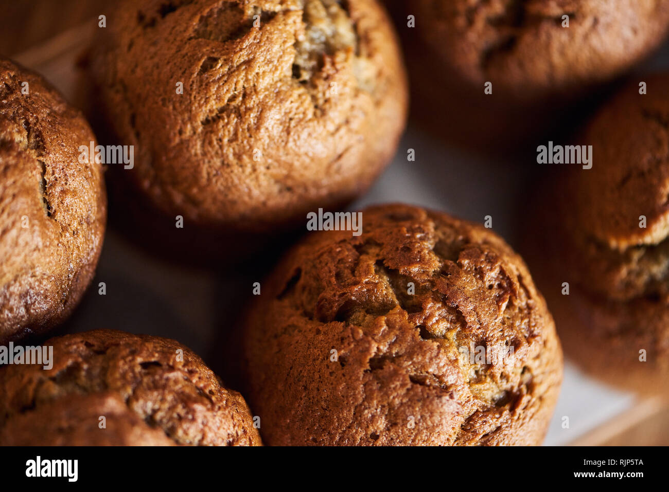 Closeup of freshly baked muffins sitting on a table Stock Photo