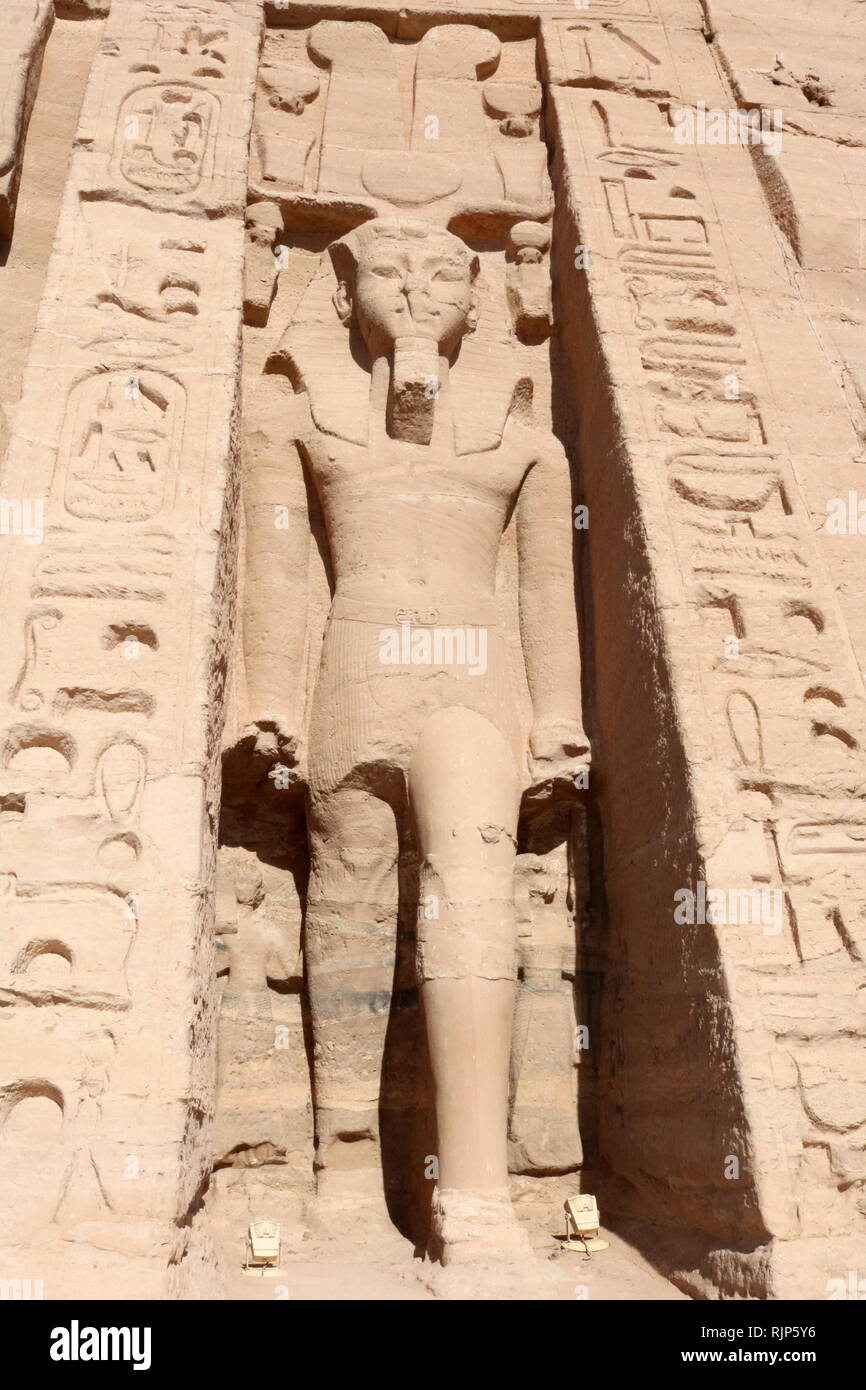 A photograph taken of the temple of Hathor and Nefertari, also known as the Small Temple. The temple was built about one hundred meters northeast of the temple of Pharaoh Ramesses II and dedicated to the goddess Hathor and Ramesses II's chief consort, Nefertari, circa 1255 BC. Nefertari, also known as Nefertari Meritmut, was an Egyptian queen and the first of the Great Royal Wives (or principal wives) of Ramesses the Great. Stock Photo