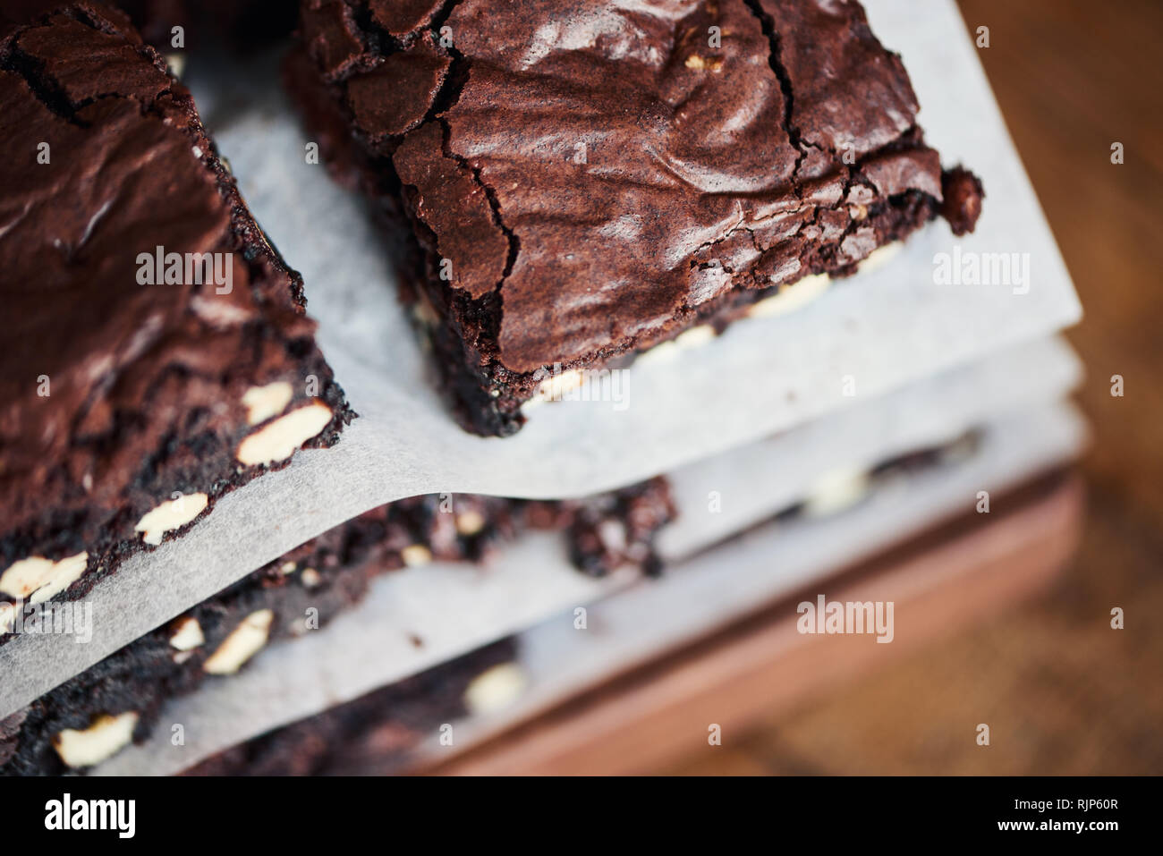 Closeup of a freshly baked stack of nutty chocolate brownies  Stock Photo