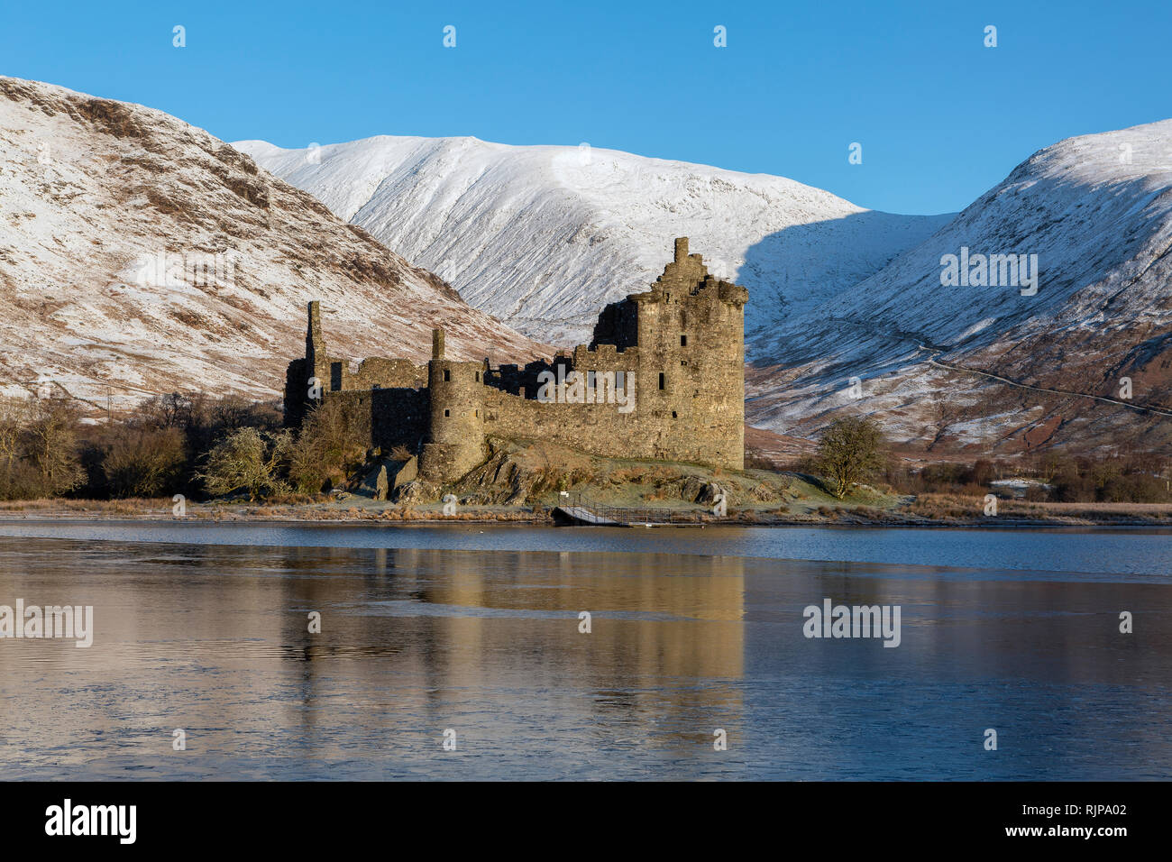 Kilchurn Castle by a partially frozen Loch Awe, Argyll and Bute, Scotland Stock Photo