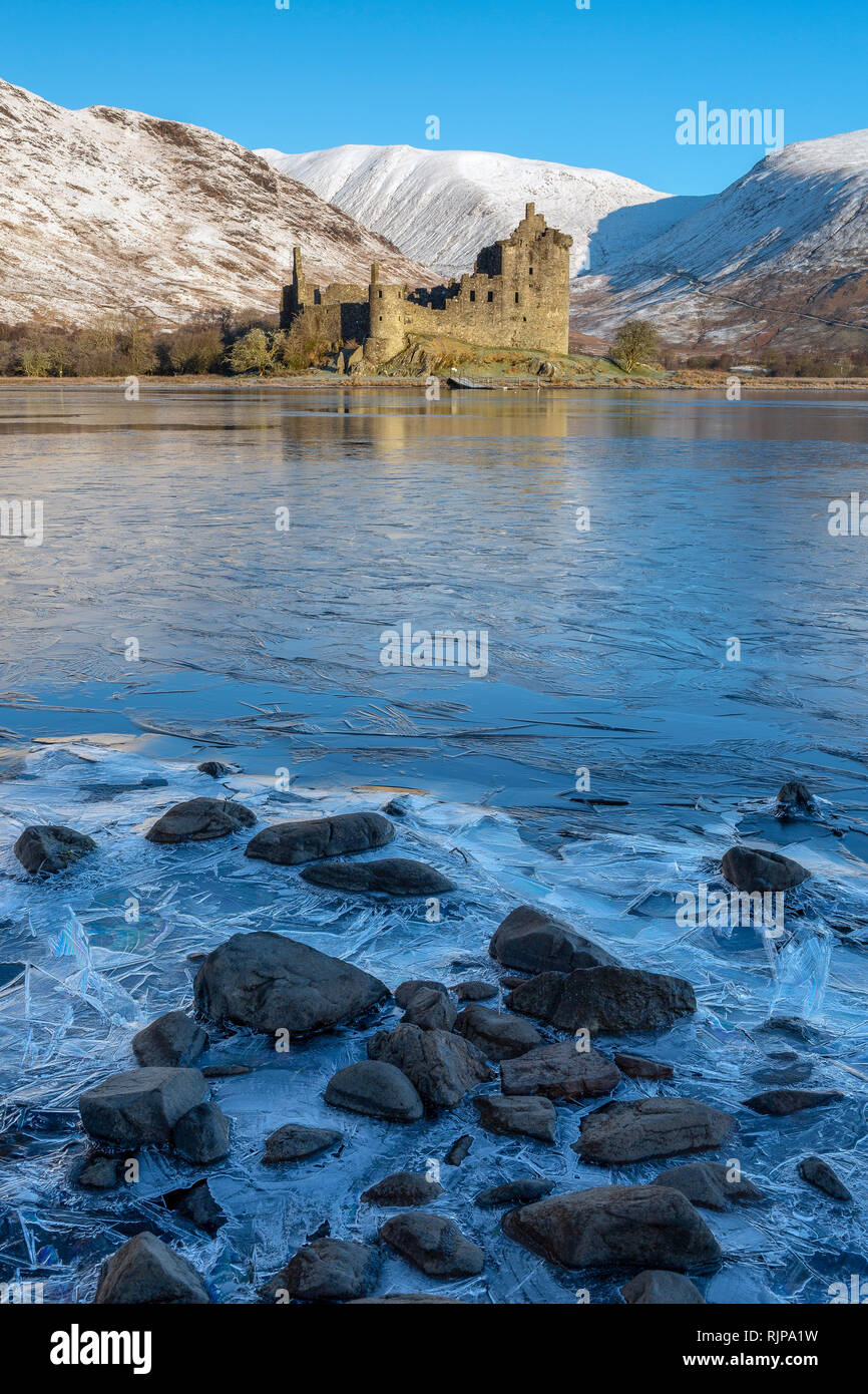 Kilchurn Castle by a partially frozen Loch Awe, Argyll and Bute, Scotland Stock Photo