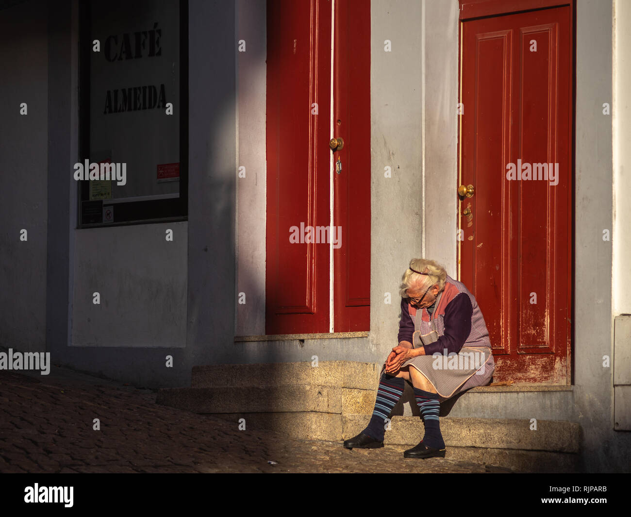 old woman grandmother sitting near his house Stock Photo - Alamy