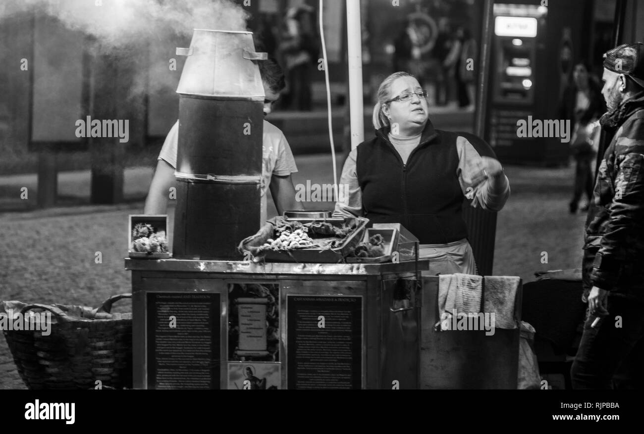 chestnut merchant in the city of porto in portugal black and white Stock Photo