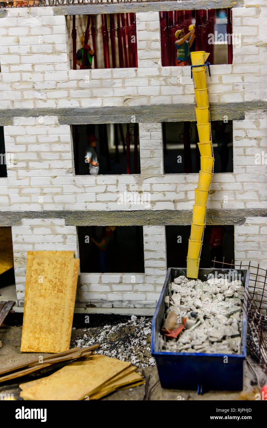 Miniature model of a waste chute on a building site , at Kolejkowo, Wrocław, Wroclaw, Wroklaw, Poland Stock Photo