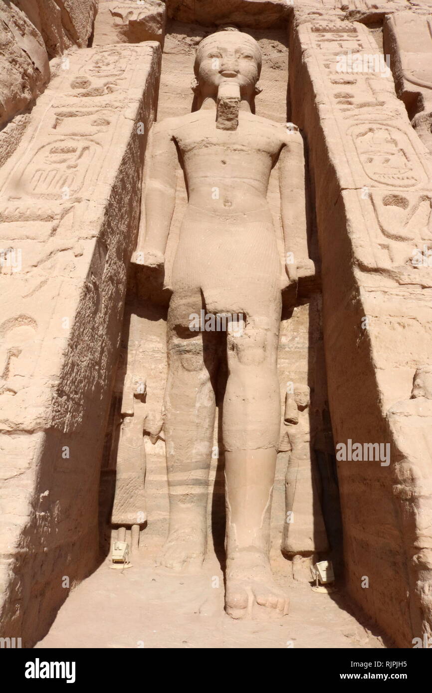 A photograph taken of the temple of Hathor and Nefertari, also known as the Small Temple. The temple was built about one hundred meters northeast of the temple of Pharaoh Ramesses II and dedicated to the goddess Hathor and Ramesses II's chief consort, Nefertari, circa 1255 BC. Nefertari, also known as Nefertari Meritmut, was an Egyptian queen and the first of the Great Royal Wives (or principal wives) of Ramesses the Great. Stock Photo