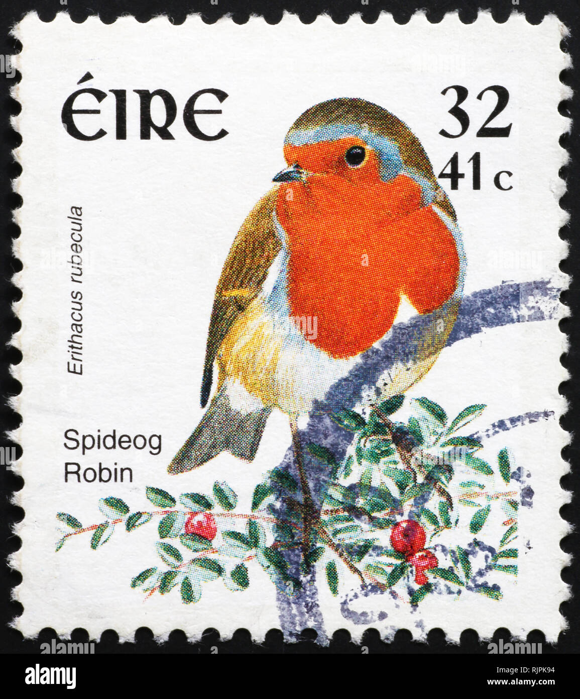 European robin on irish postage stamp Stock Photo