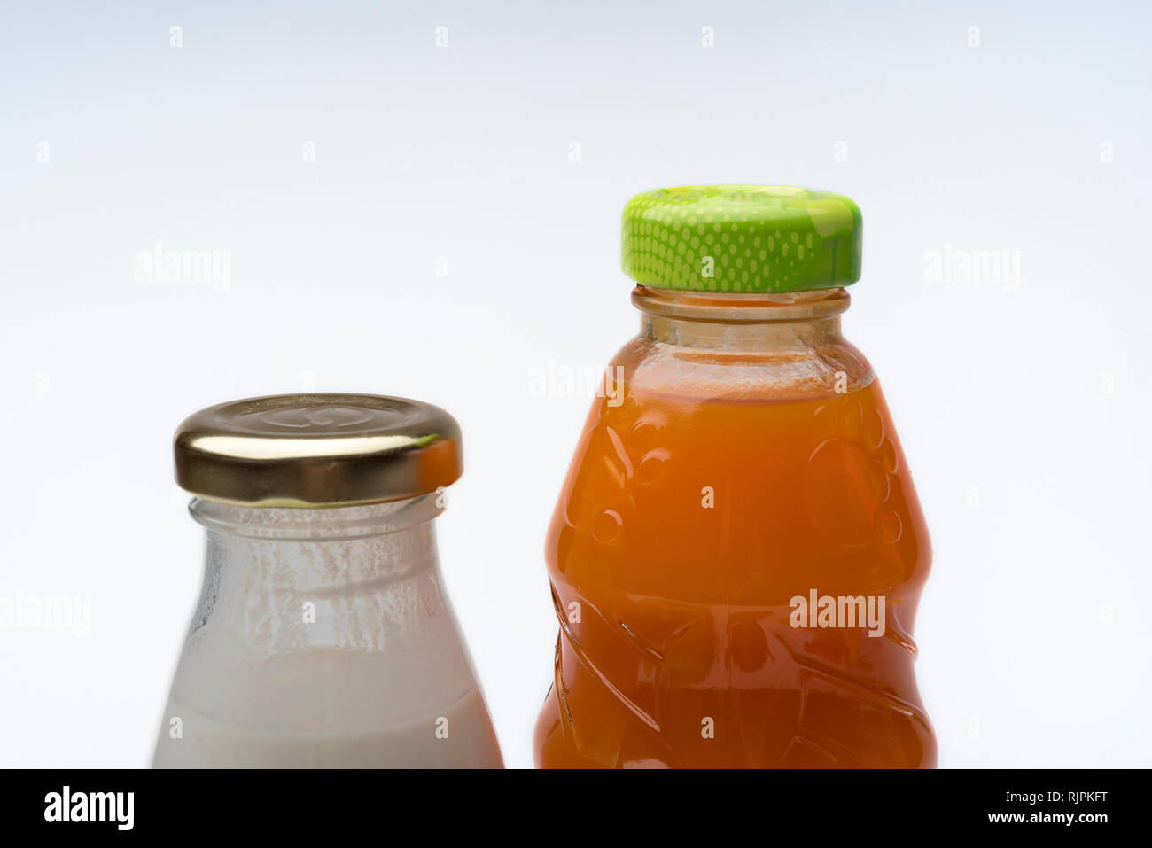 Bottle of juice and yogurt on white background. The concept of healthy