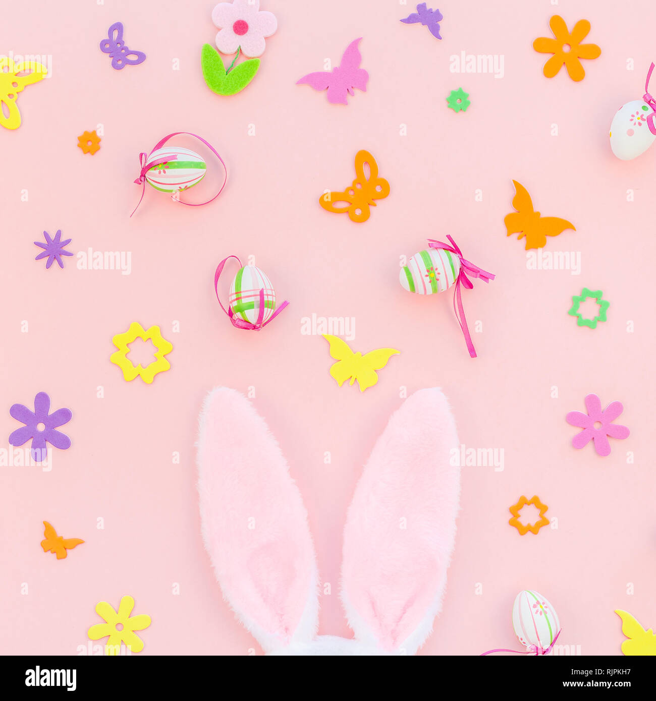 Creative Top view flat lay holiday composition Easter eggs bunny ears ...