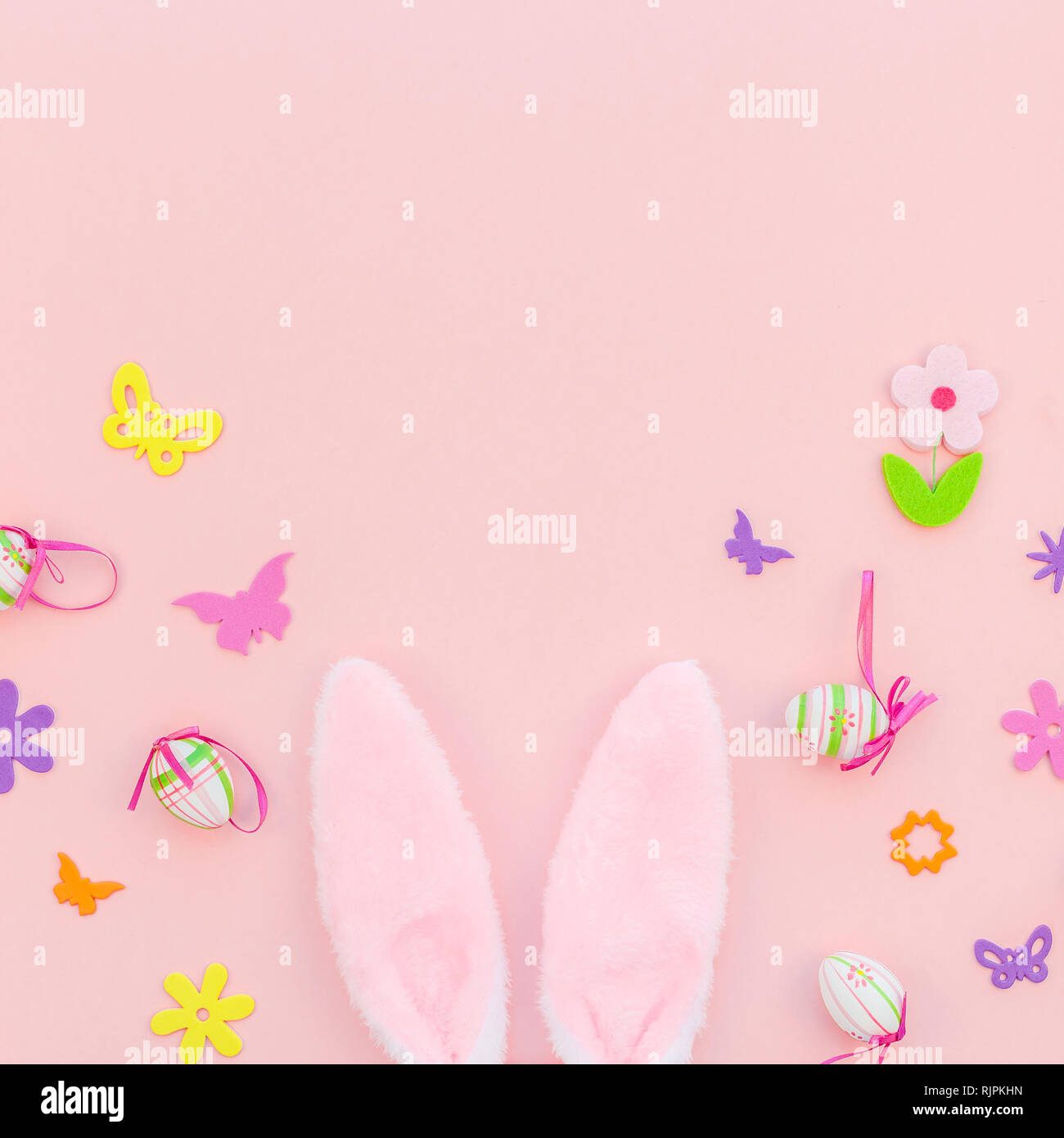 Creative Top view flat lay holiday composition Easter eggs bunny ears ...