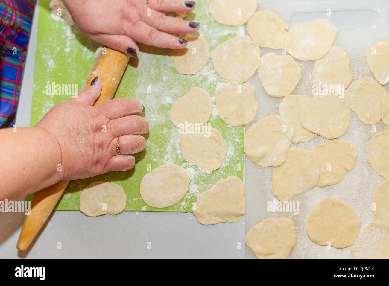 Preparation for cooking homemade dumplings woman chef at home Stock