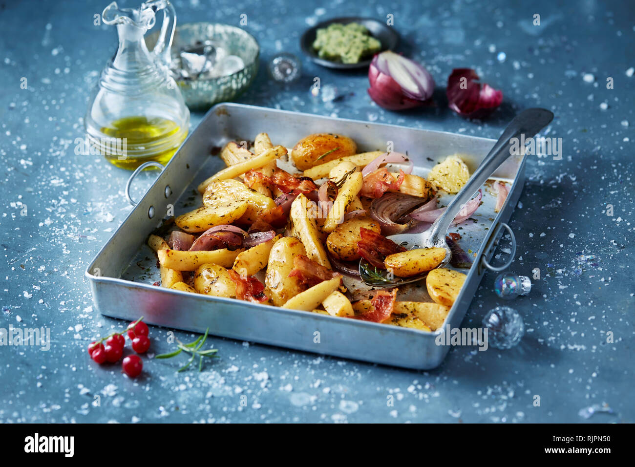 Roasted vegetables with red onions in roasting tin, seasonal christmas food Stock Photo