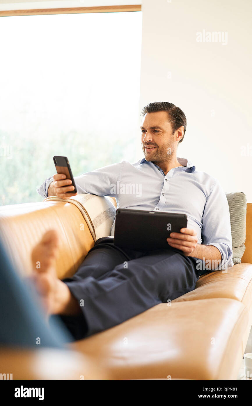 Reclining man hi-res stock photography and images - Alamy