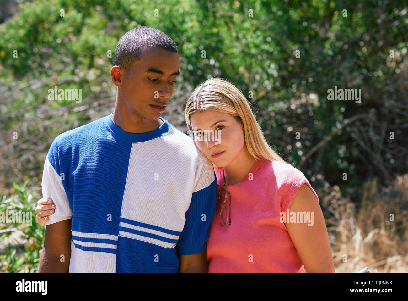 Young couple in park, portrait, Los Angeles, California, USA Stock Photo