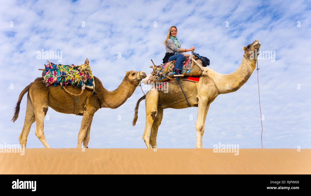 Woman Riding Camel