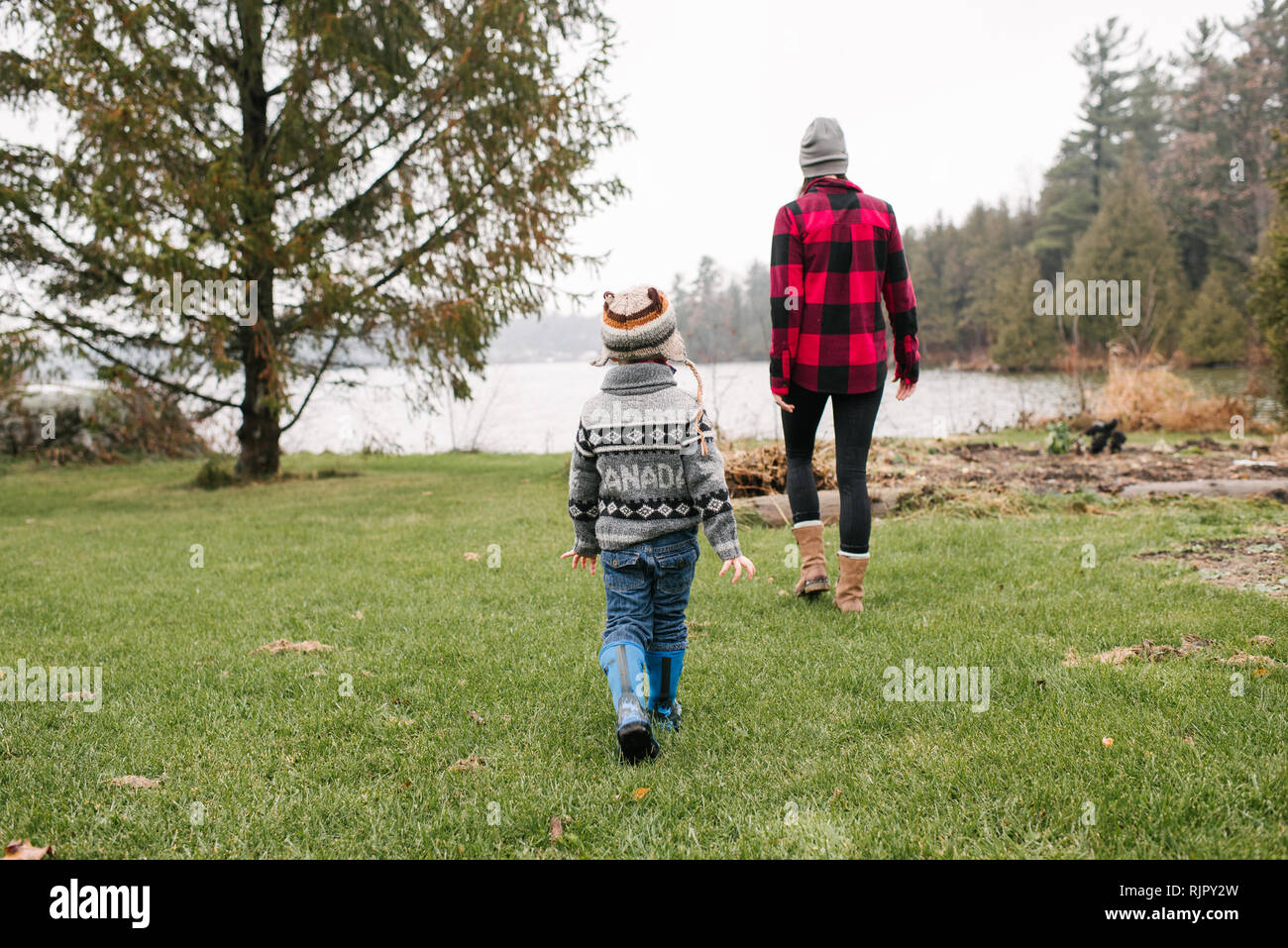 Mother and son on walk by lake, Kingston, Ontario, Canada Stock Photo