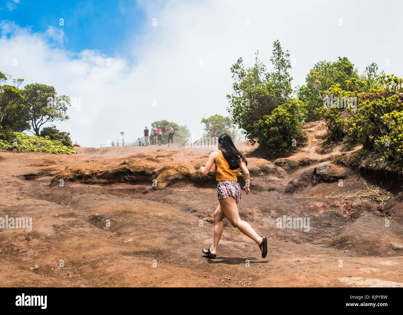 Woman in hurry, Waimea Canyon, Kauai, Hawaii Stock Photo