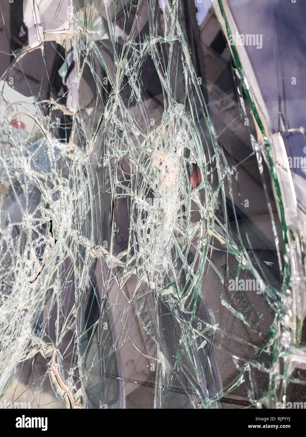 Car windshield shattered with stones by vandals Stock Photo Alamy