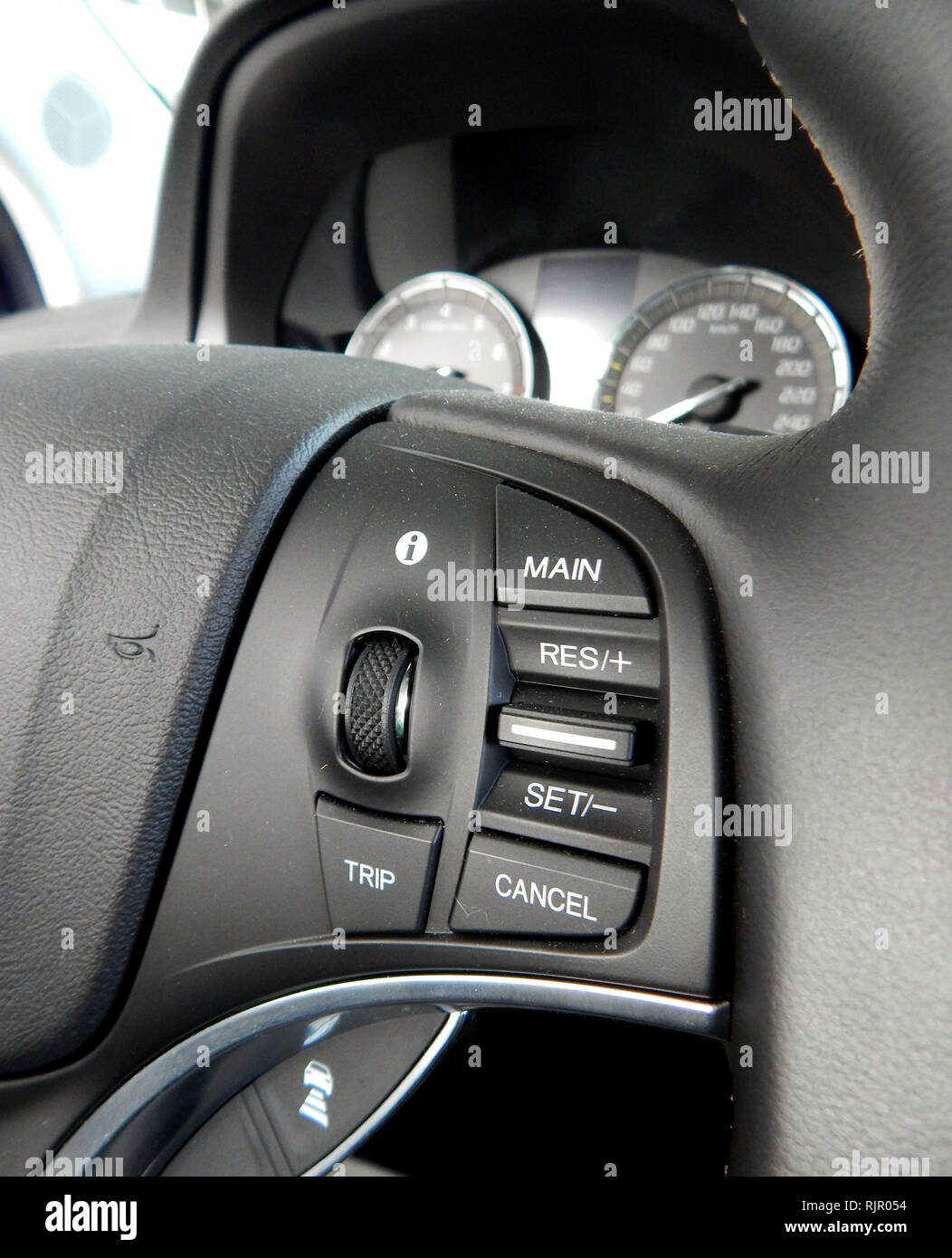 Settngs button and control buttons on the multifunction steering wheel