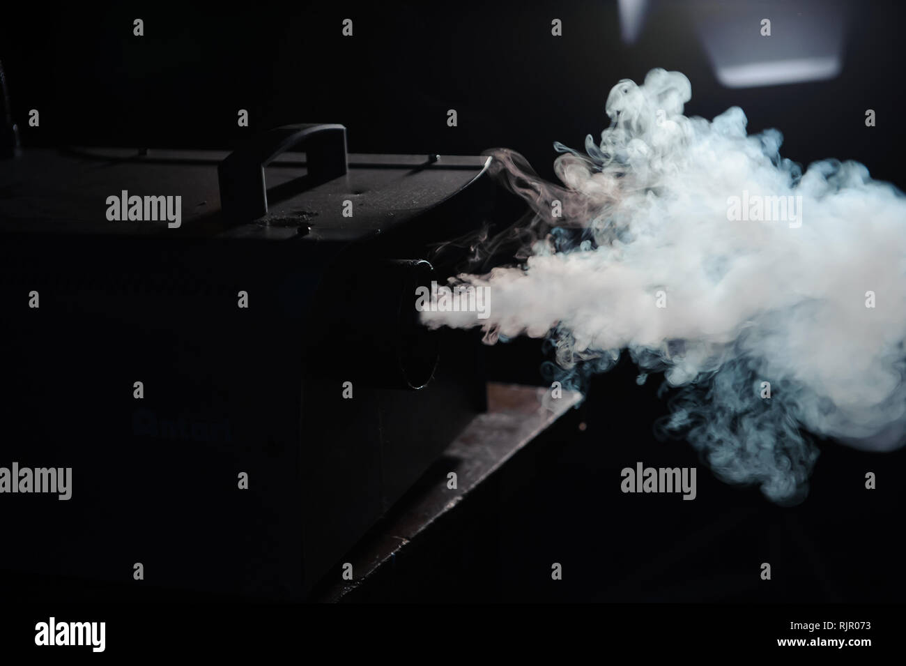 lights in smoke, studio lights shining through the smoke Stock Photo