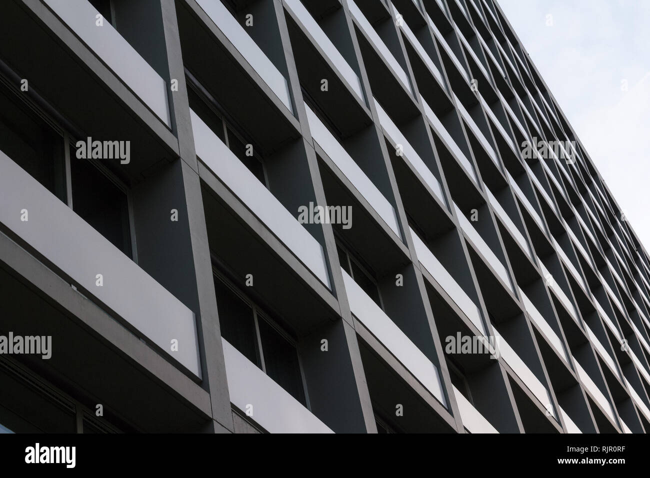 View of council flats. Exterior of complex building in the city. Urban environment Stock Photo