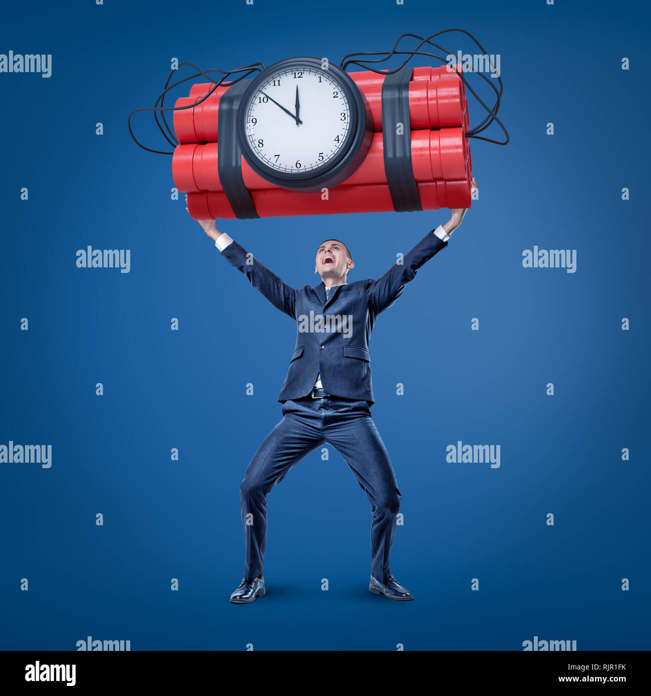 A joyful businessman in smart suit holding up a huge bundle of dynamite with a time bomb attached to it. Drastic measures. Risky business. Neck or not Stock Photo