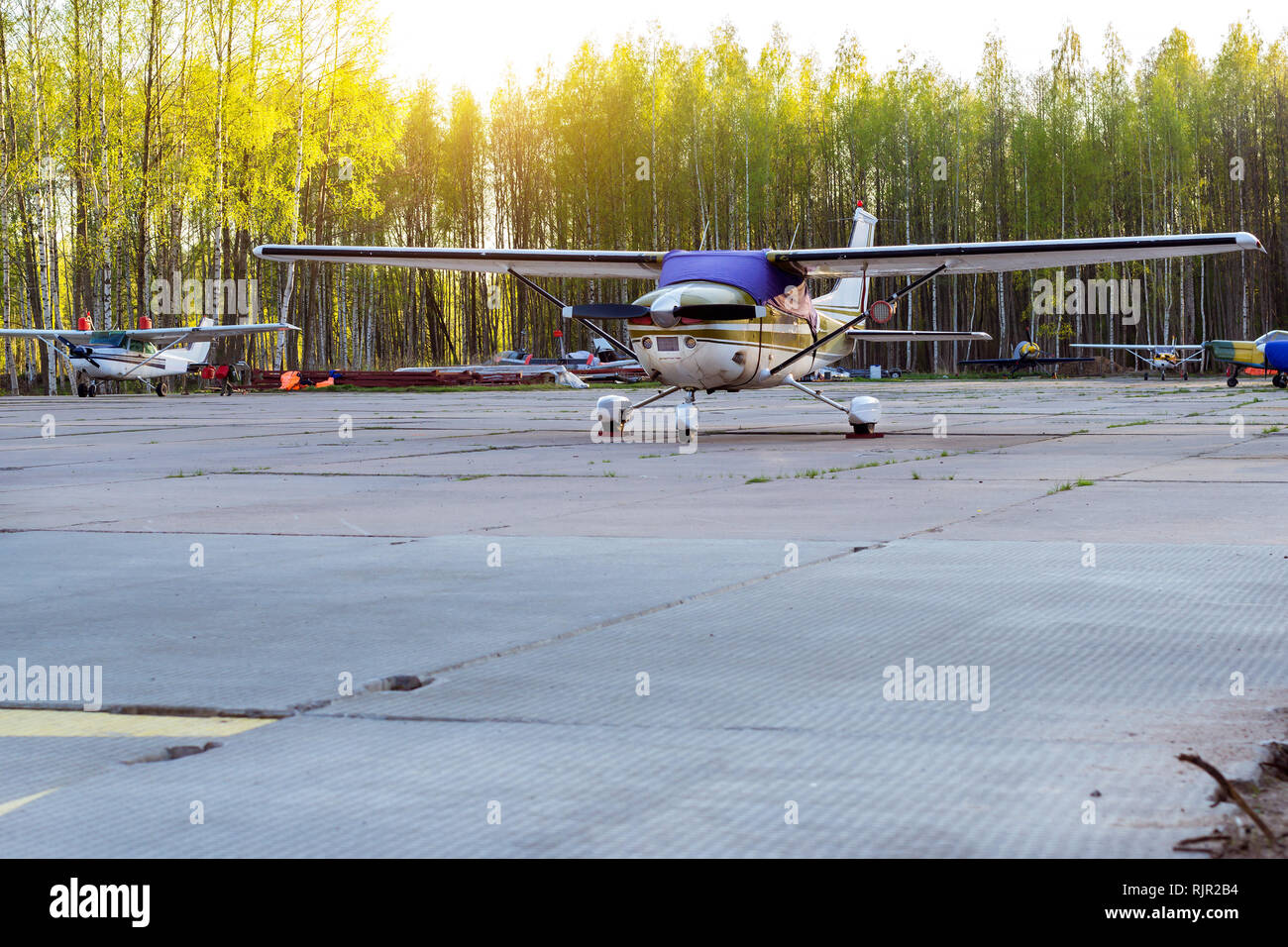 Light passenger planes parked before departure at private airport in Kronshtadt, St.Petersburg Russia. Industrial and civil air transportation by aircraft. Professional flights on airplanes Stock Photo
