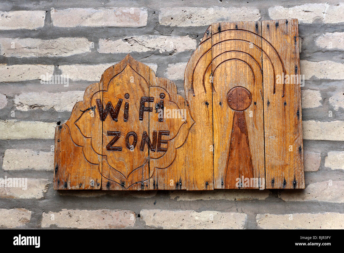 Oriental wooden sign WIFI zone - Khiva, Uzbekistan Stock Photo