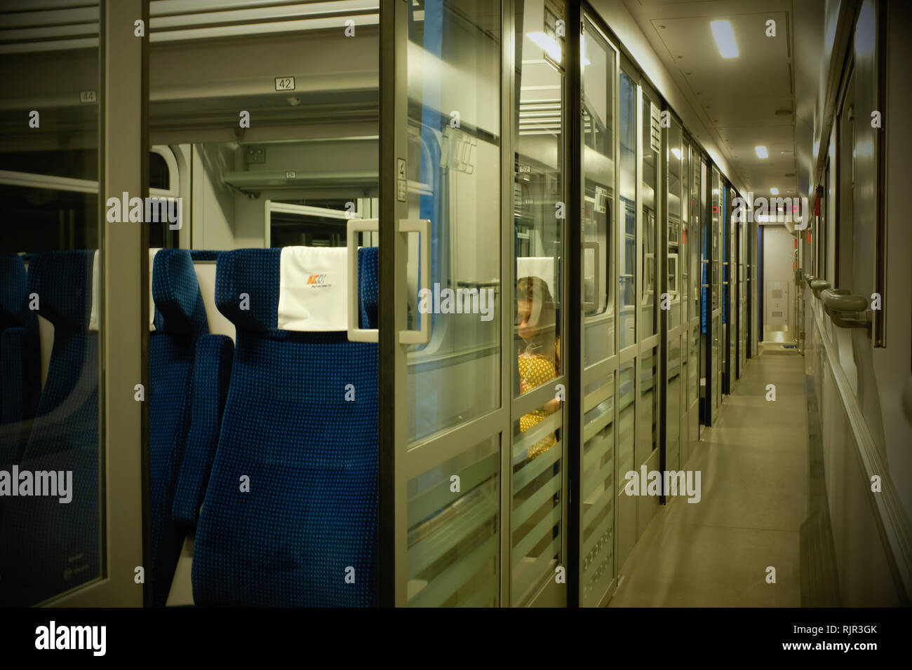 corridor on a train with separate compartments on a railway passenger