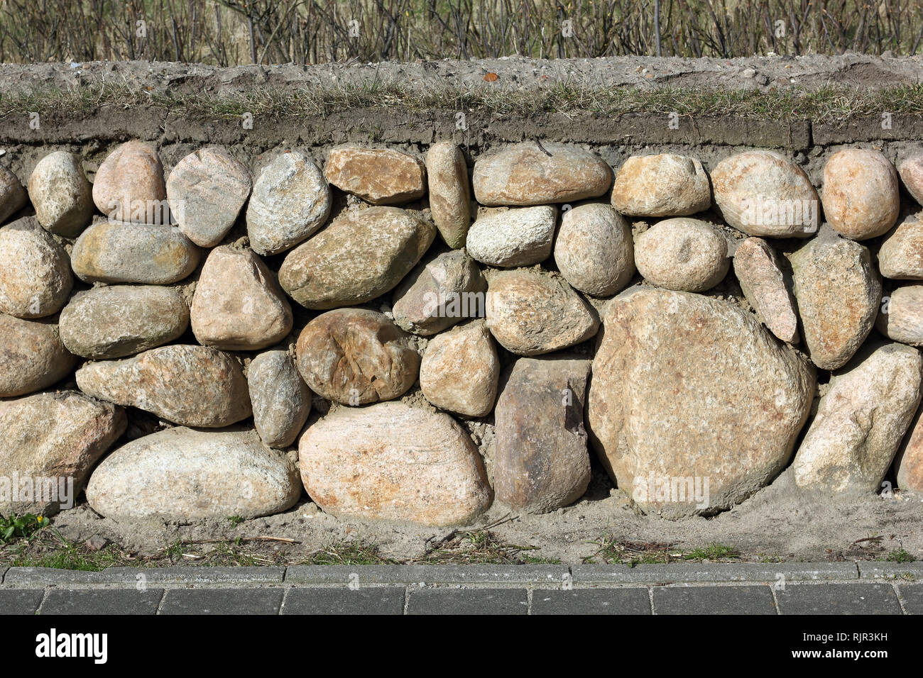 New built Frisian stone wall on the island of Sylt in Germany Stock Photo