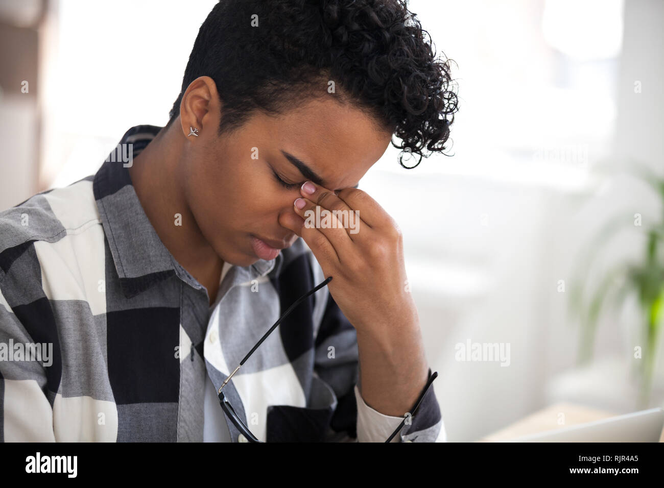 Tired african woman taking off glasses feel eye strain Stock Photo Alamy