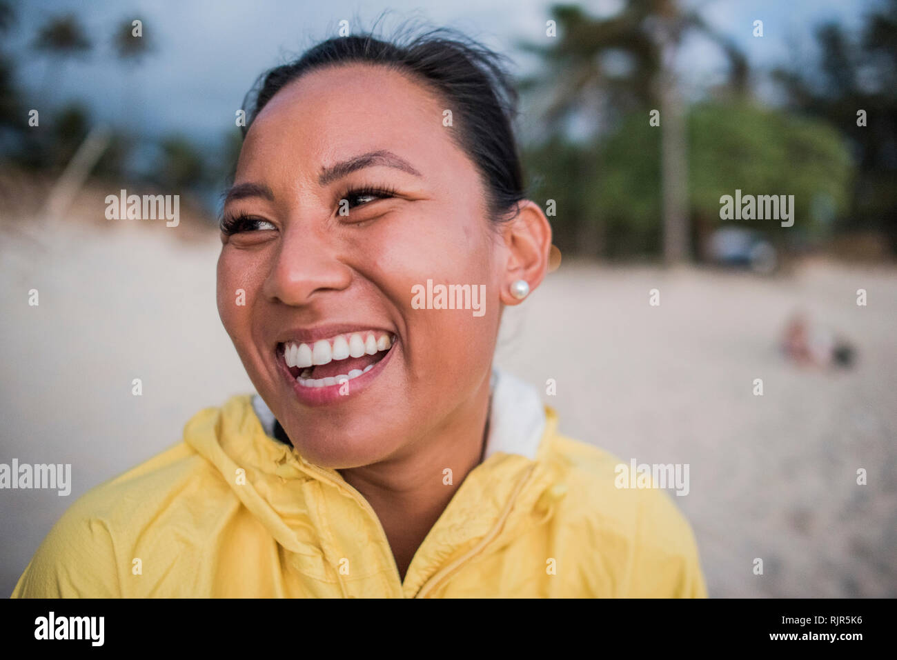 Portrait of laughing woman, Kailua Beach, Oahu, Hawaii Stock Photo