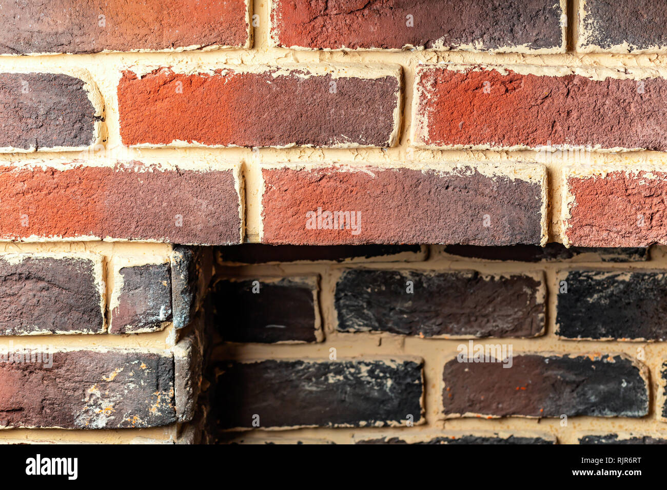 Fragment of a brick wall fireplace with a rectangular niche Stock Photo