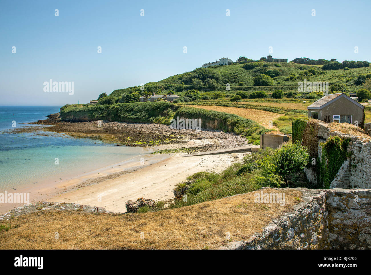 View south west along Longis Bay Alderney, taken from the walls of a Roman Fort built on an iron age site. Stock Photo