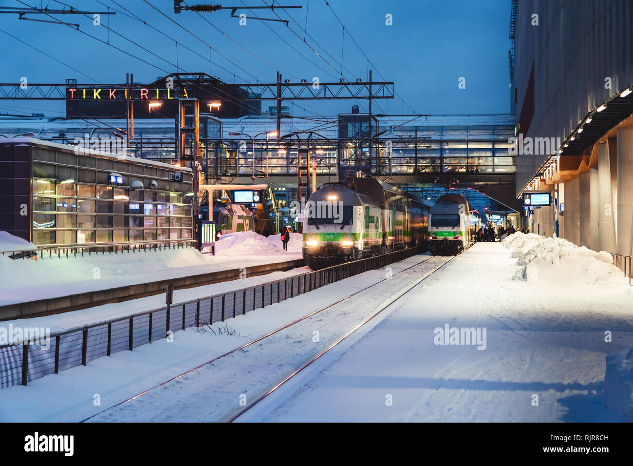 Editorial 01.18.2019 Vantaa Finland. Trains waiting to leave at the railway station in Tikkurila at winter Stock Photo