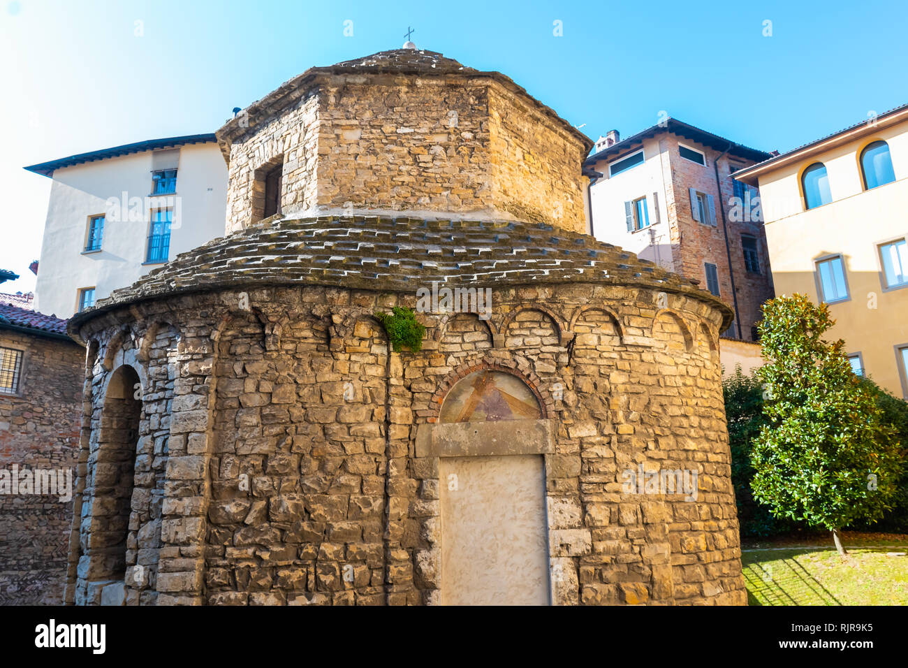 Very old Tempietto of Santa Croce hidden octagonal Romanesque chapel from 11st century in Citta Alta, Bergamo, Italy. Stock Photo