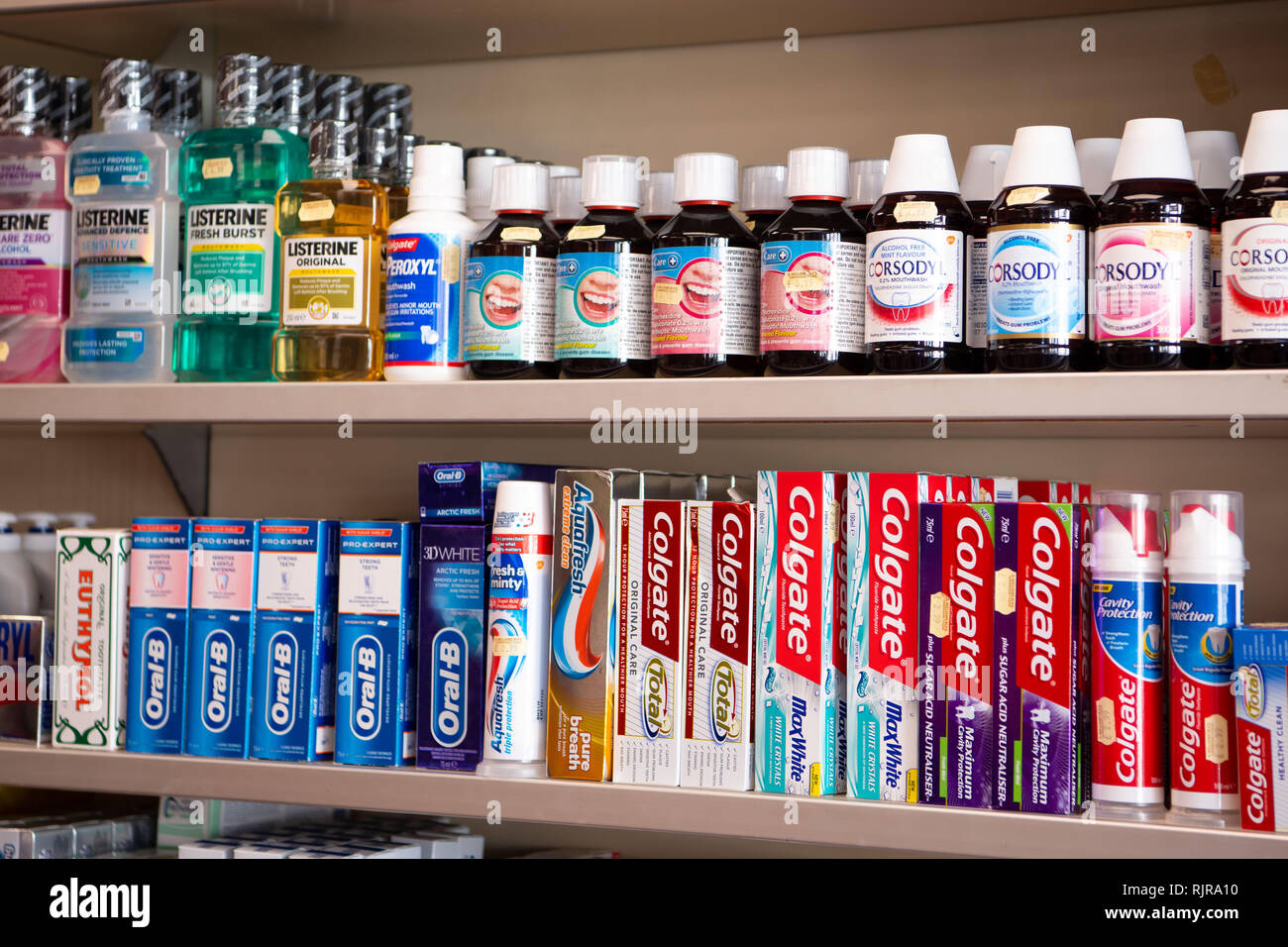 Dental care products on sale in a chemist store in the UK Stock Photo