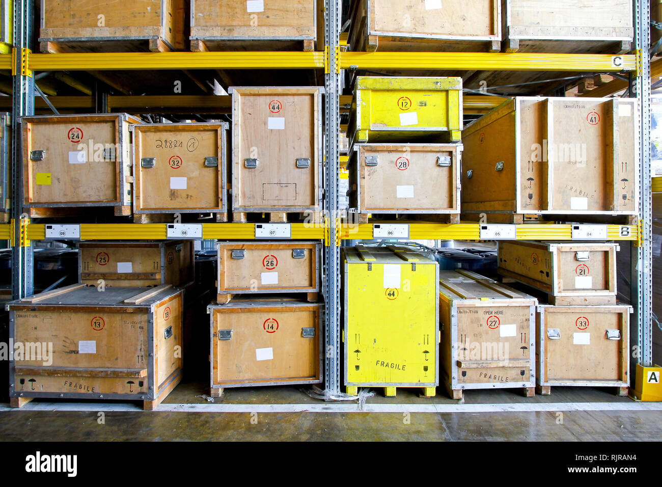 Wooden crates at shelves in museum warehouse Stock Photo