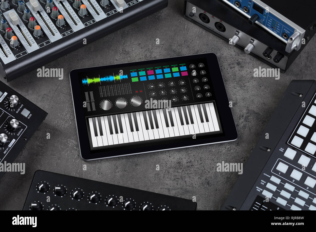 Piano synthesizer app on tablet and musical instrument concept Stock